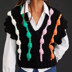 Chunky black knit vest with colorful 3D
